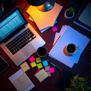 Cluttered Office Desk with Business Tools – free AI stock image