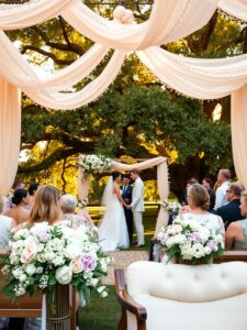 Elegant Outdoor Wedding Ceremony Under a Canopy – free AI stock image