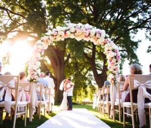 Elegant Wedding Ceremony Under Beautiful Arch – free AI stock image