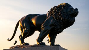 Majestic Bronze Lion in Sunset Glow – free AI stock image