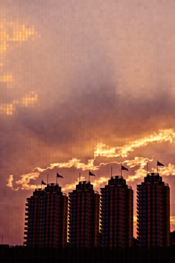 Modern Skyscrapers Against a Sunset Sky – free AI stock image