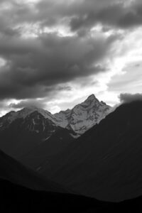 Monochrome Mountain Landscape Under a Cloudy Sky – free AI stock image