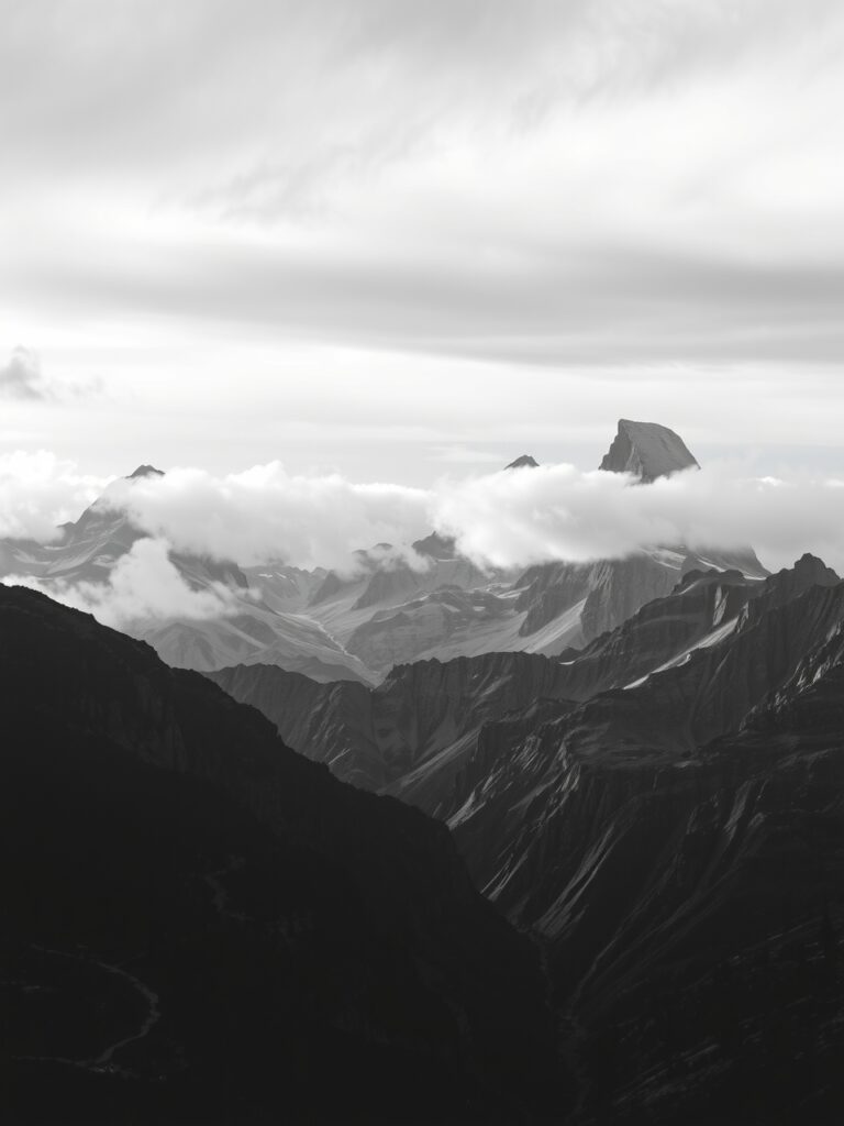 Monochrome Mountains Under a Dull Sky – free AI stock image