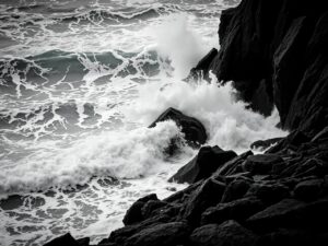 Monochrome Waves Crashing on Rocky Shore – free AI stock image