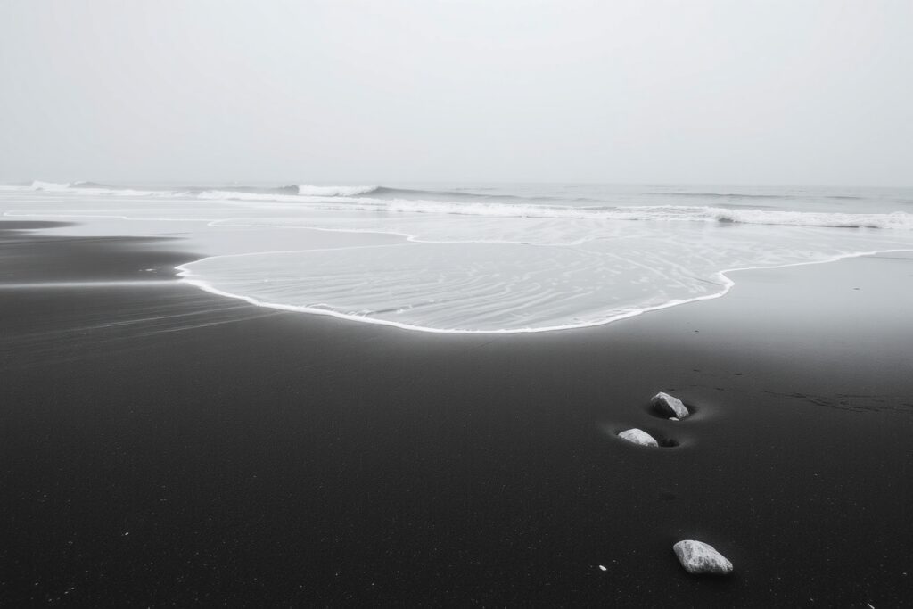 Monochrome Waves on a Serene Beach – free AI stock image