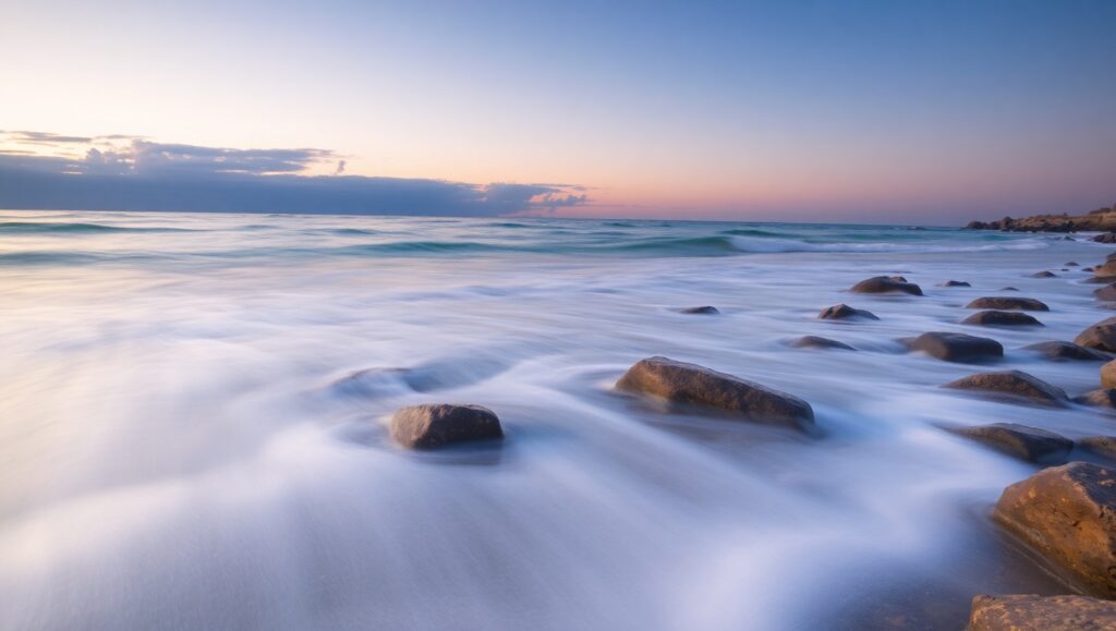 Serene Beach at Sunset Long Exposure – free AI stock image