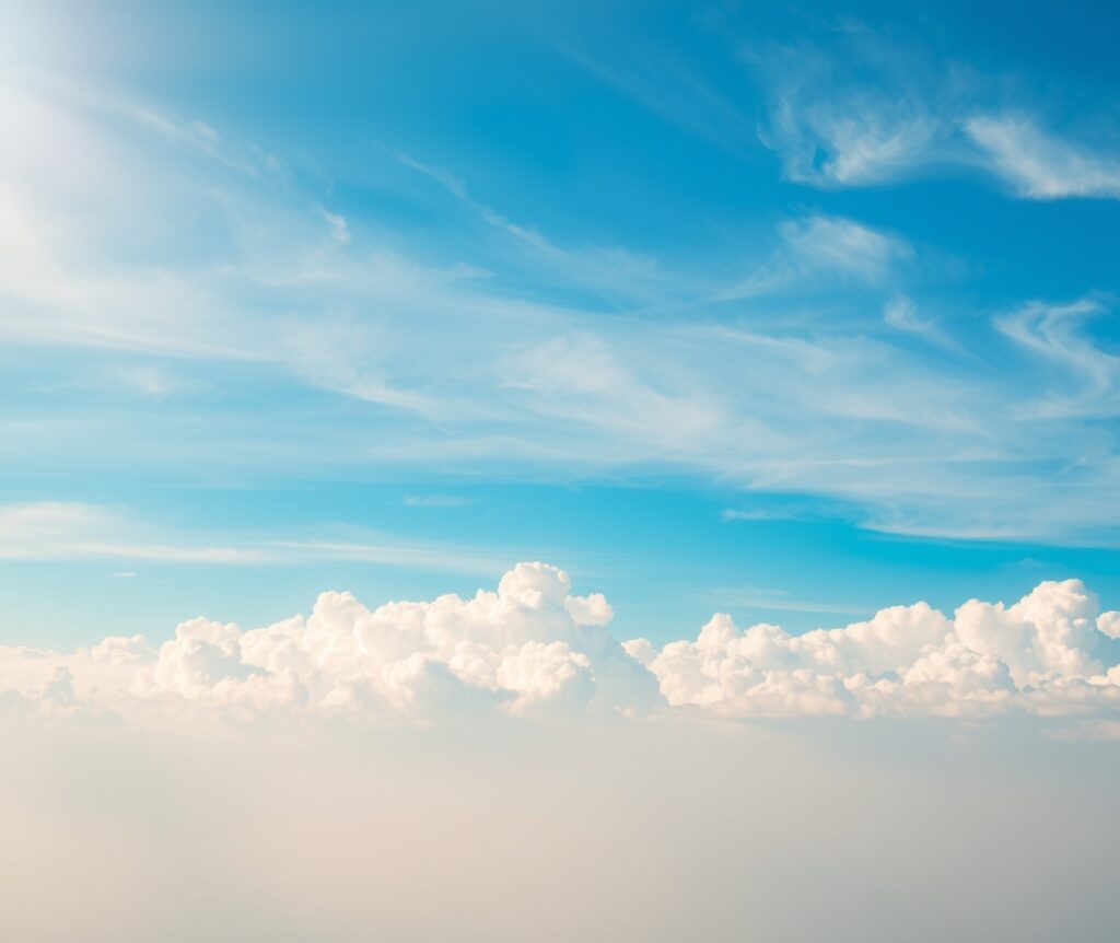Serene Blue Sky with Soft White Clouds – free AI stock image