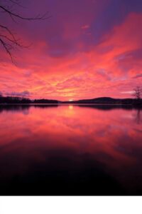 Serene Sunset Over a Tranquil Lake – free AI stock image