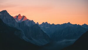 Serene Sunset Over Mountain Peaks – free AI stock image