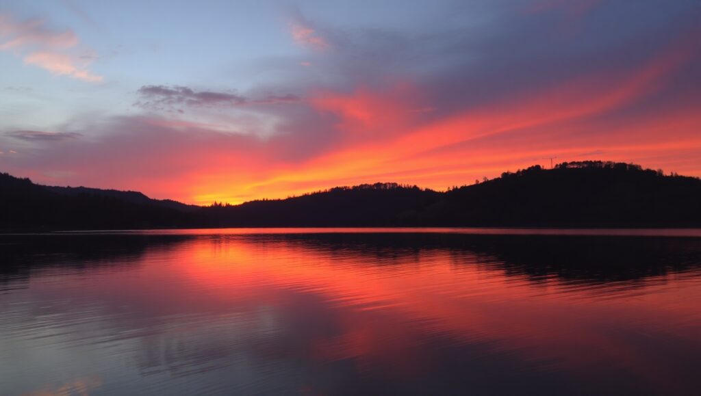 Serene Sunset Reflections on Water – free AI stock image