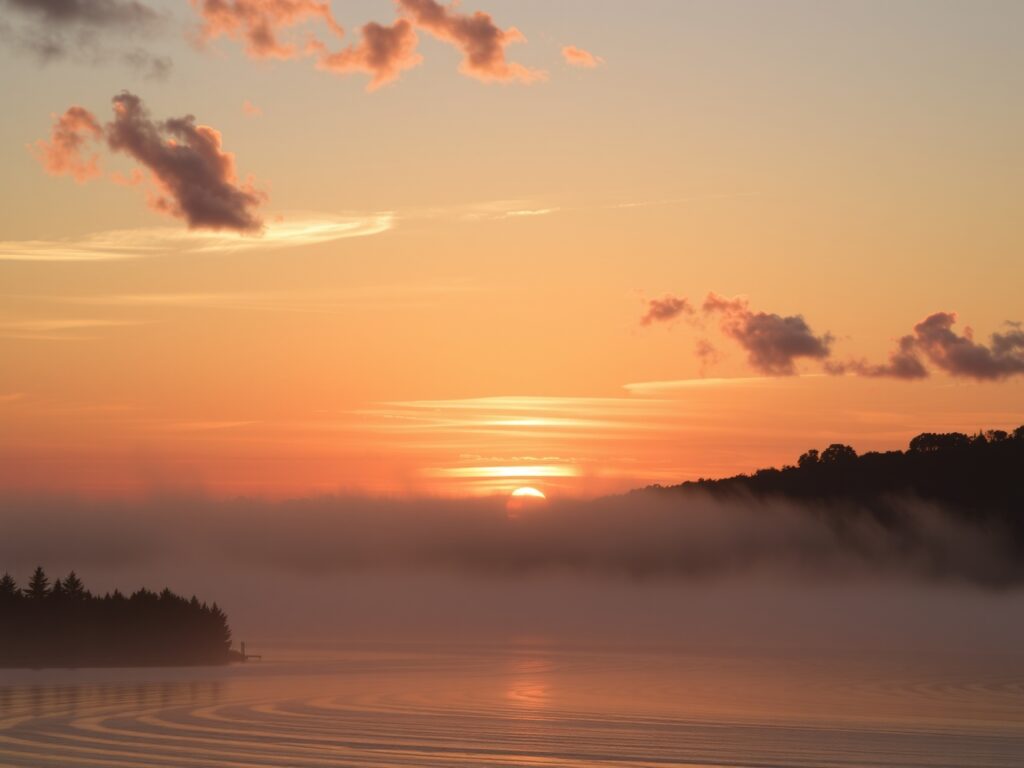 Serene Tranquil Sunrise Over Water – free AI stock image