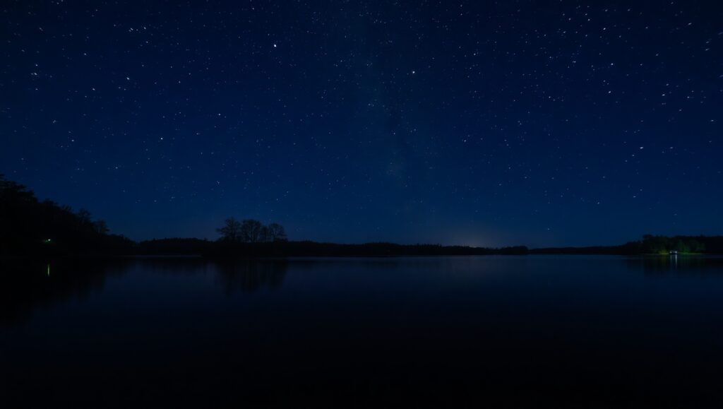 Stars in Motion Over Calm Water – free AI stock image