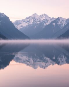 Still Lake with Mountains Reflecting at Dawn – free AI stock image