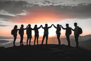 Teamwork at Sunrise Over the Mountains – free AI stock image