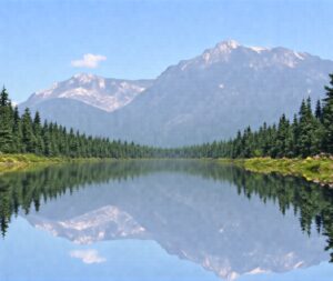 Tranquil Lake Surrounded by Majestic Mountains – free AI stock image