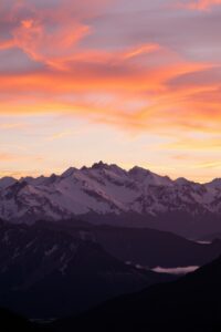 Tranquil Sunrise Over a Mountain Range – free AI stock image
