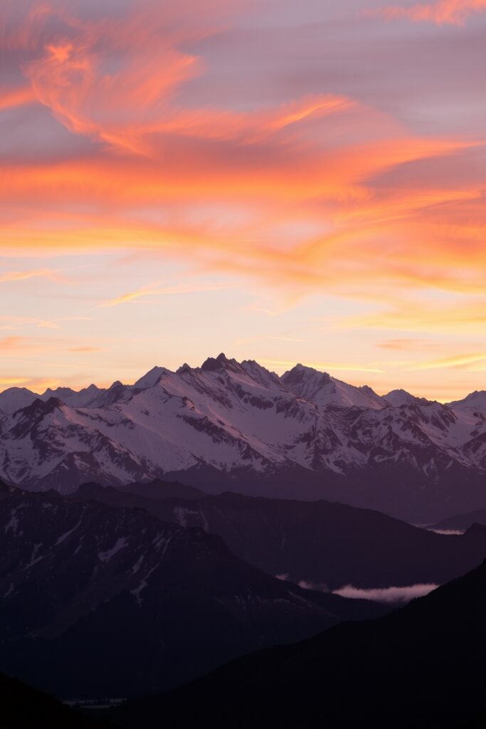 Tranquil Sunrise Over a Mountain Range – free AI stock image