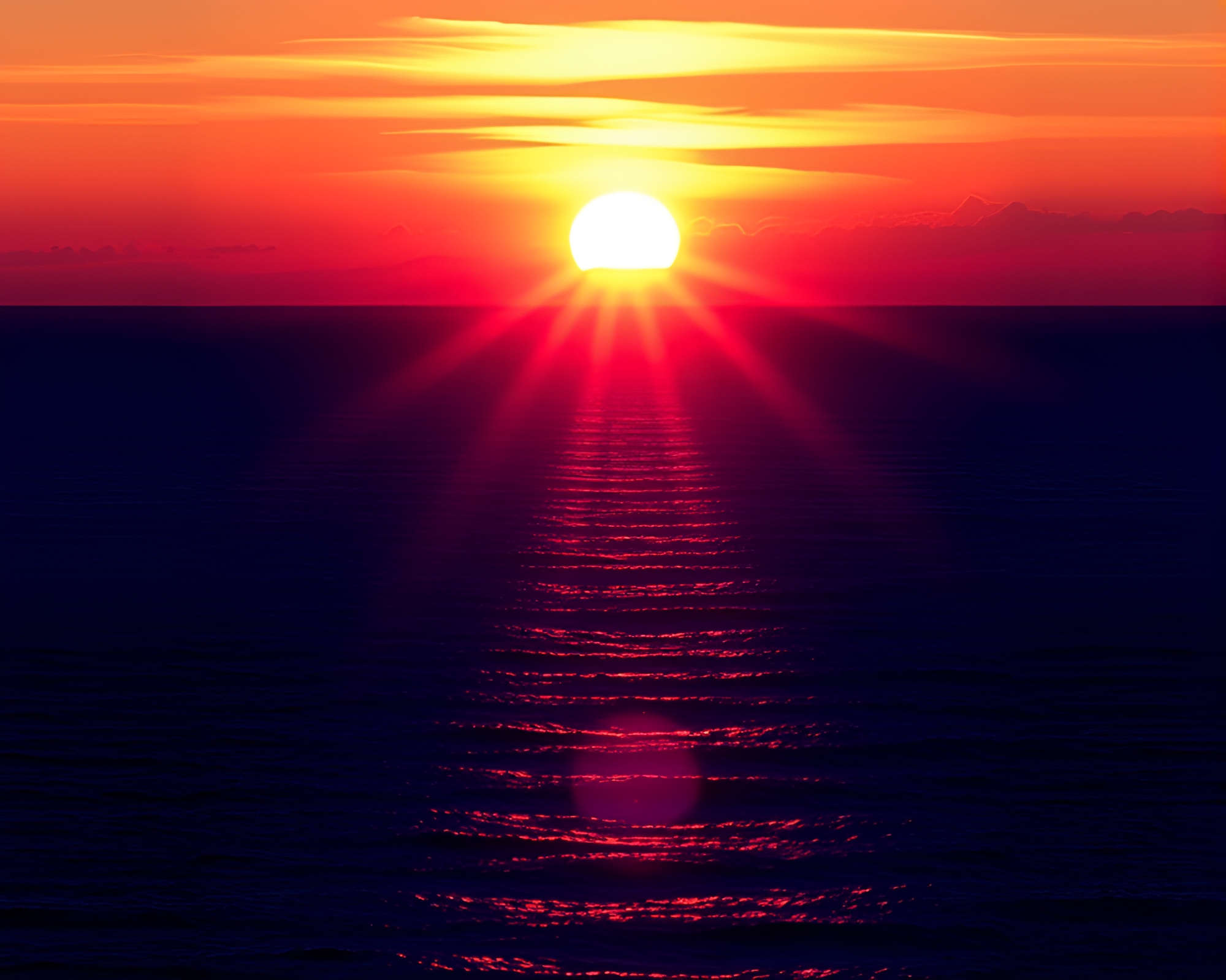 Vibrant Solar Flare Reflects in Mesmerizing Ocean Sunset – free AI stock image