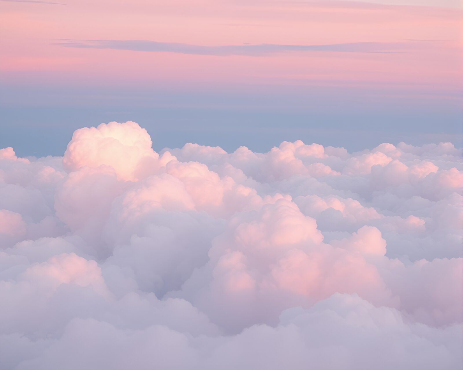 Soft pastel hues blend in a tranquil cloudscape.