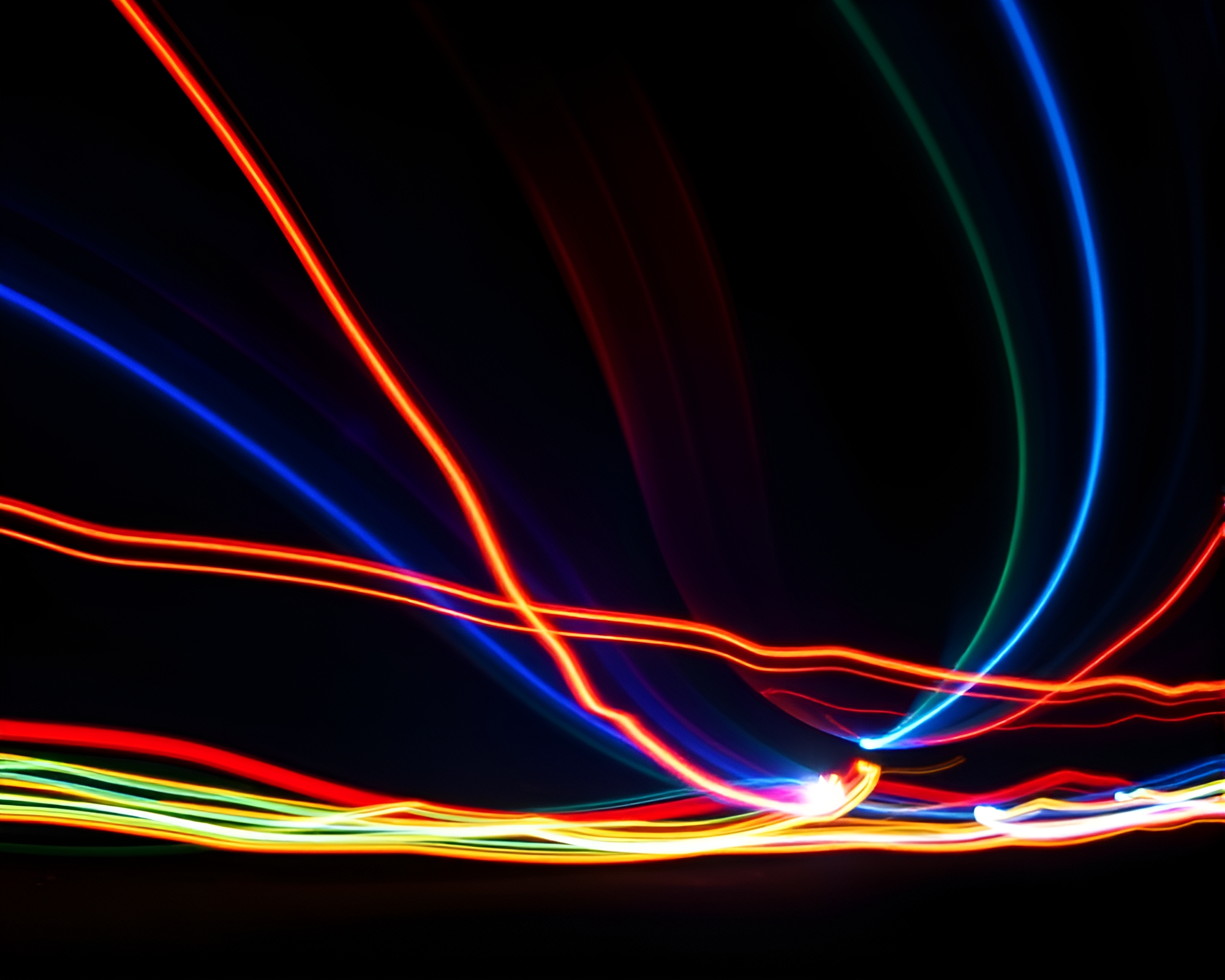 Vibrant Kinetic Light Trails Illuminate Dark Night Sky – free AI stock image