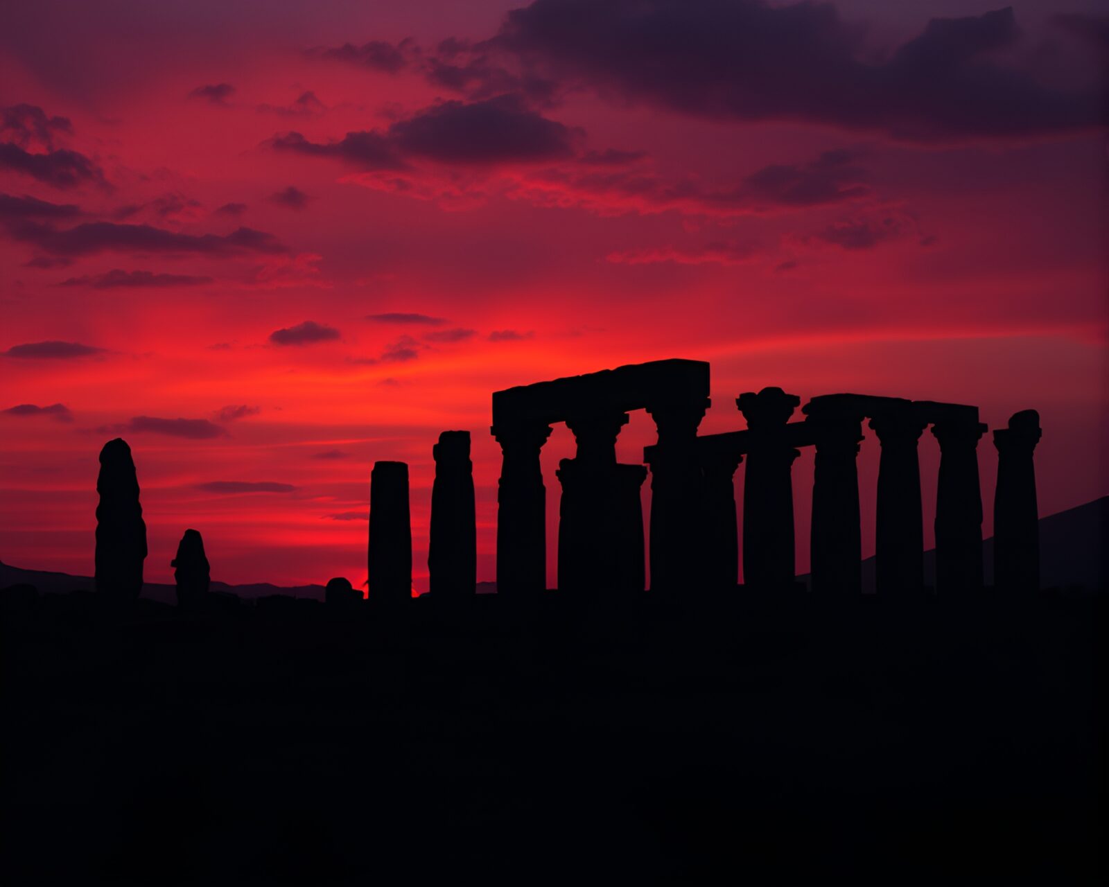 Eerie twilight casts shadows over ancient monolithic ruins.