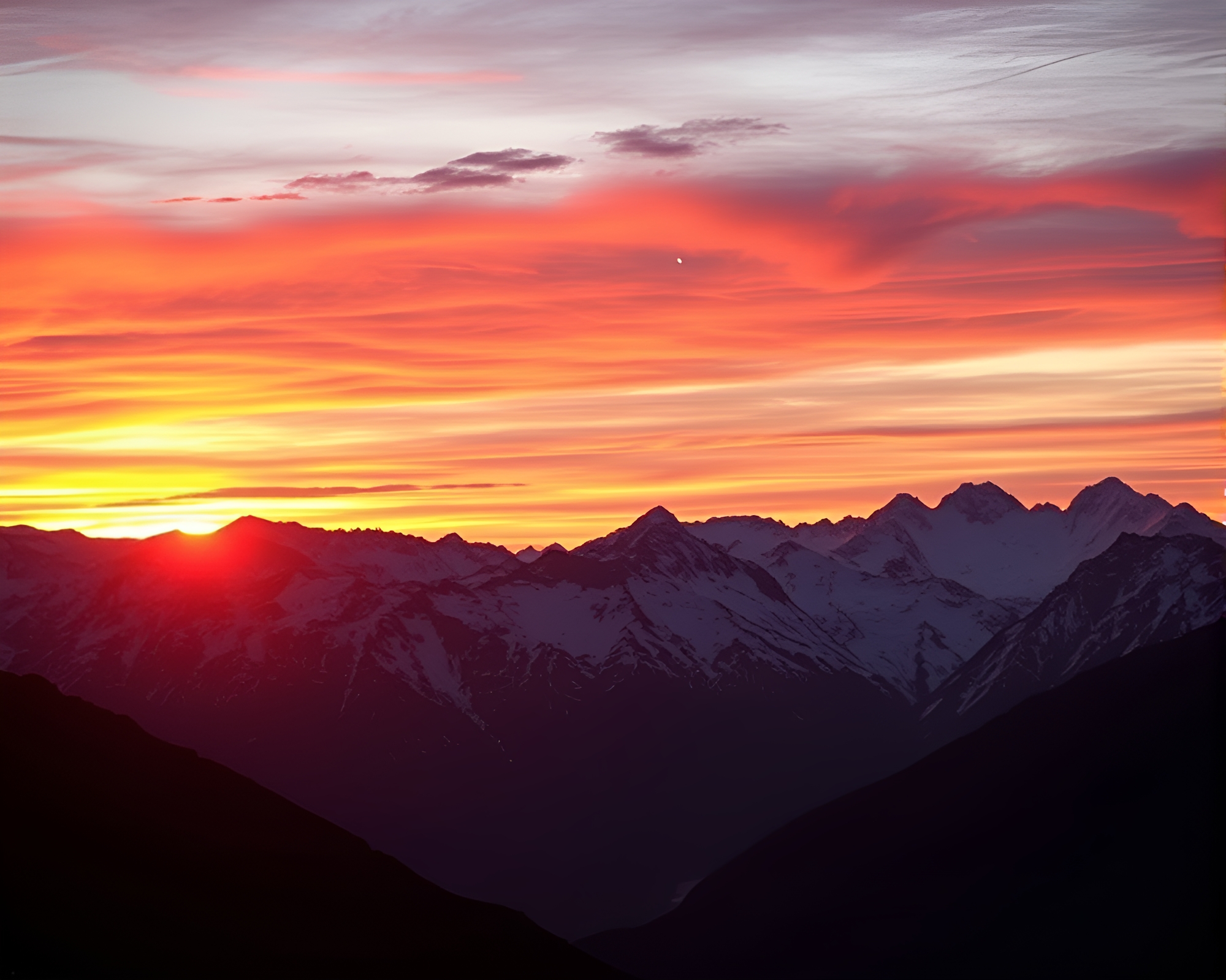 Vibrant Sunset Over Snow-Capped Peaks – free AI stock image