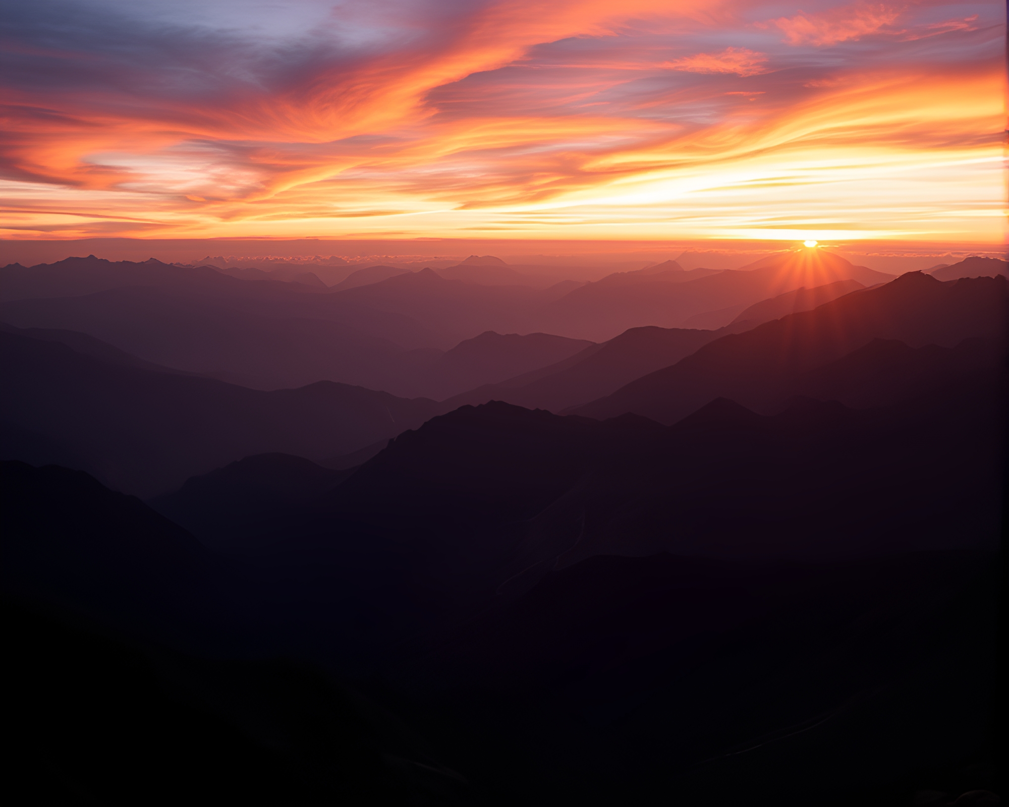 Majestic Mountain Range at Sunset – free AI stock image