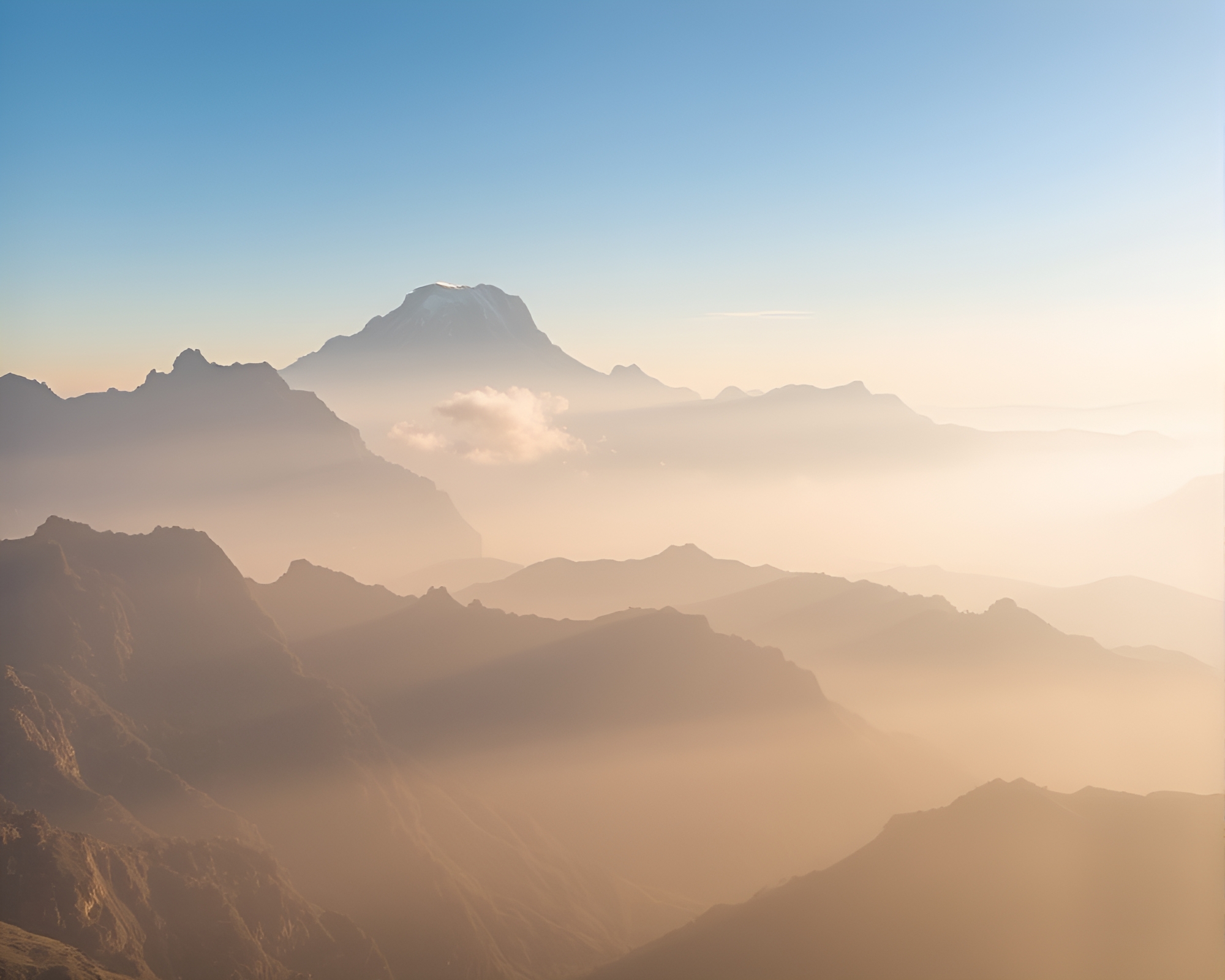 Majestic Peaks Bathed in Misty Morning Light – free AI stock image