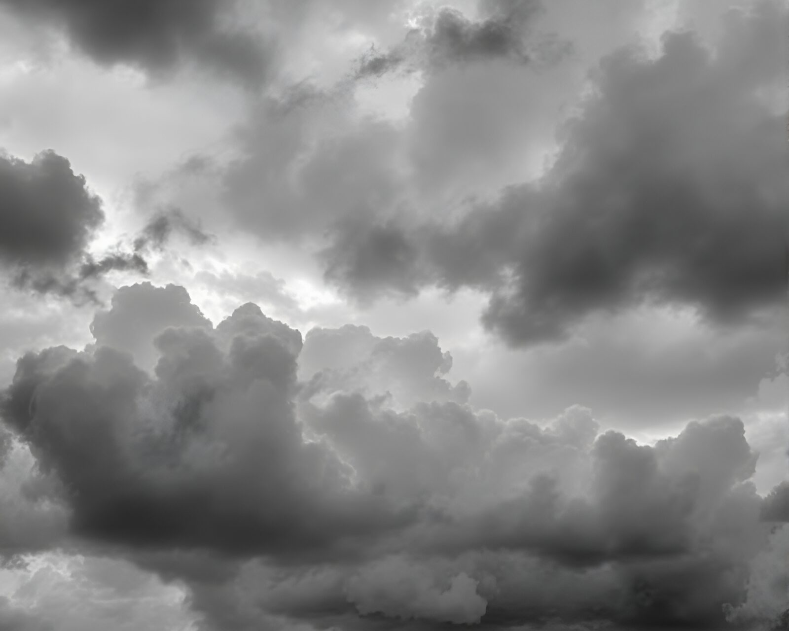 Detailed charcoal sketch of iron-colored cloud-filled melancholic sky scene