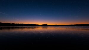 Fireflies Dancing Over a Calm Lake – free AI stock image