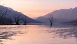 Minimalist Sunrise Over Tranquil Lake – free AI stock image