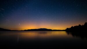 Starry Lake Reflection at Night – free AI stock image
