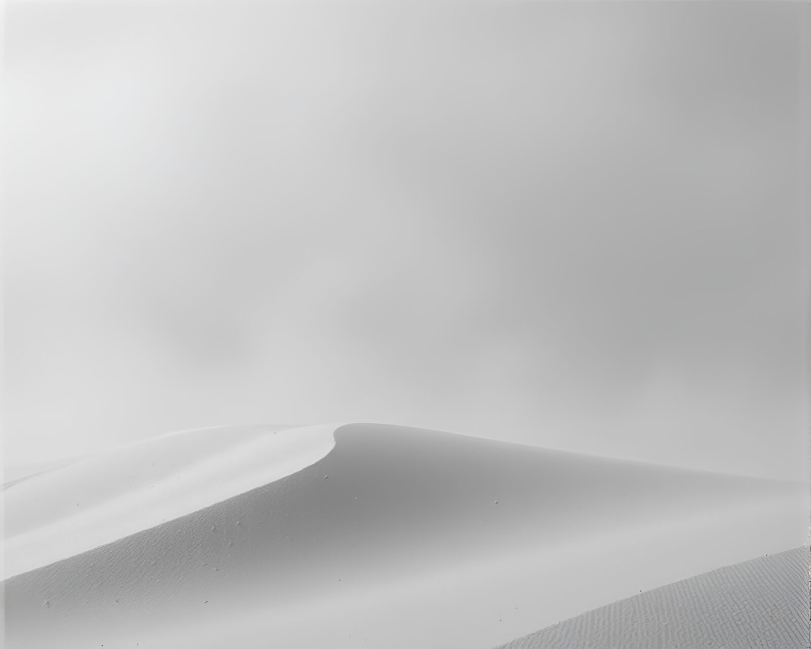 Dark, moody sand dune landscape with dust particles