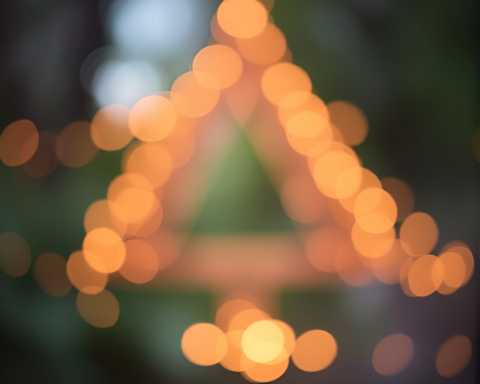 Peachy glowing sacred geometry with bokeh foreground and vignette