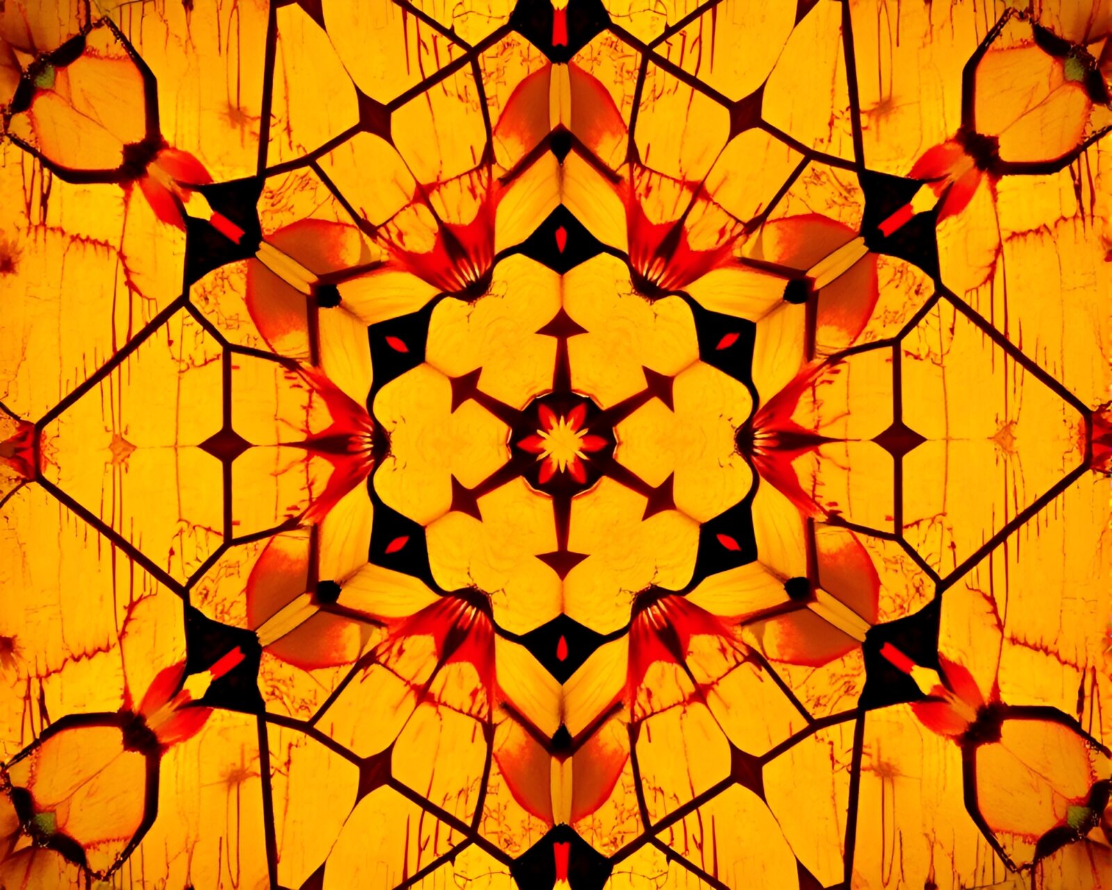 Vibrant warm colors in hexagonal kaleidoscope pattern with dripped paint