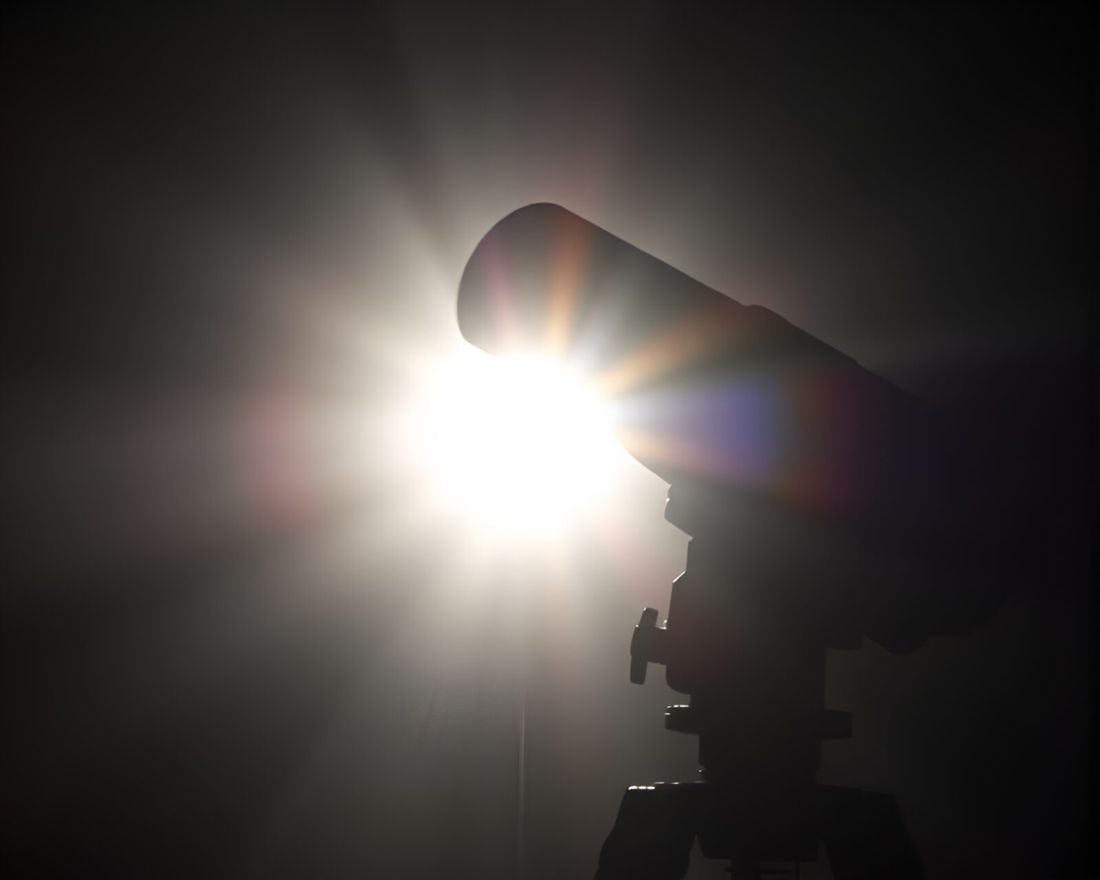 Colorful silhouette illustration of a telescope with high-key lighting