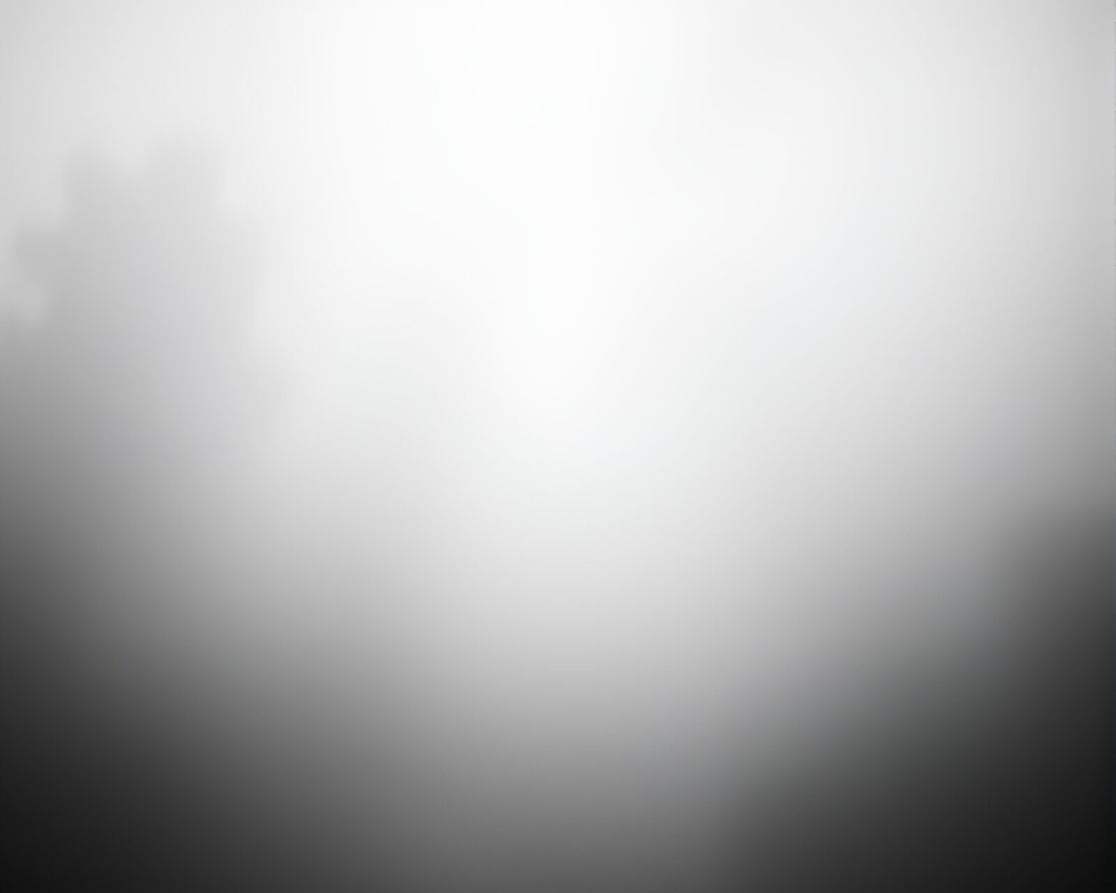 Spiral camera lens shrouded in mist with halftone pattern