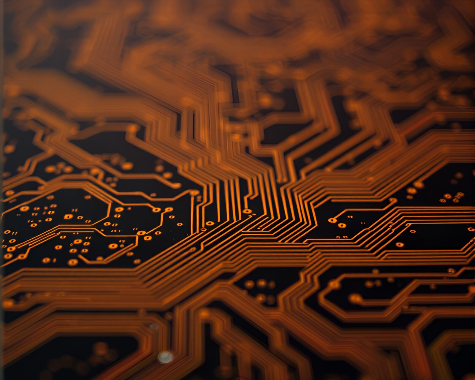 Aesthetic low light photo of circuit board with sunset hues