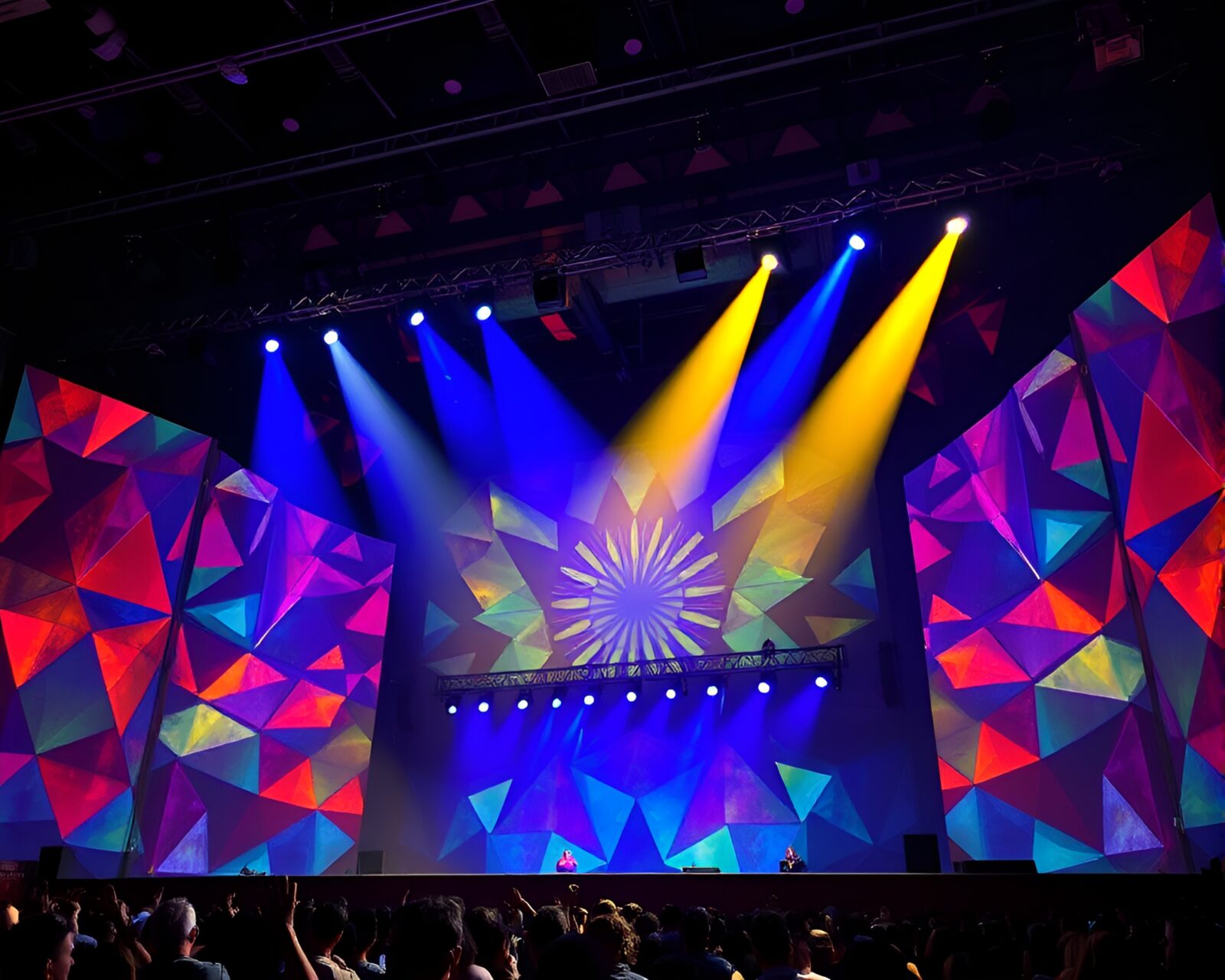 Vibrant geometric patterns illuminated by colorful stage lights mural