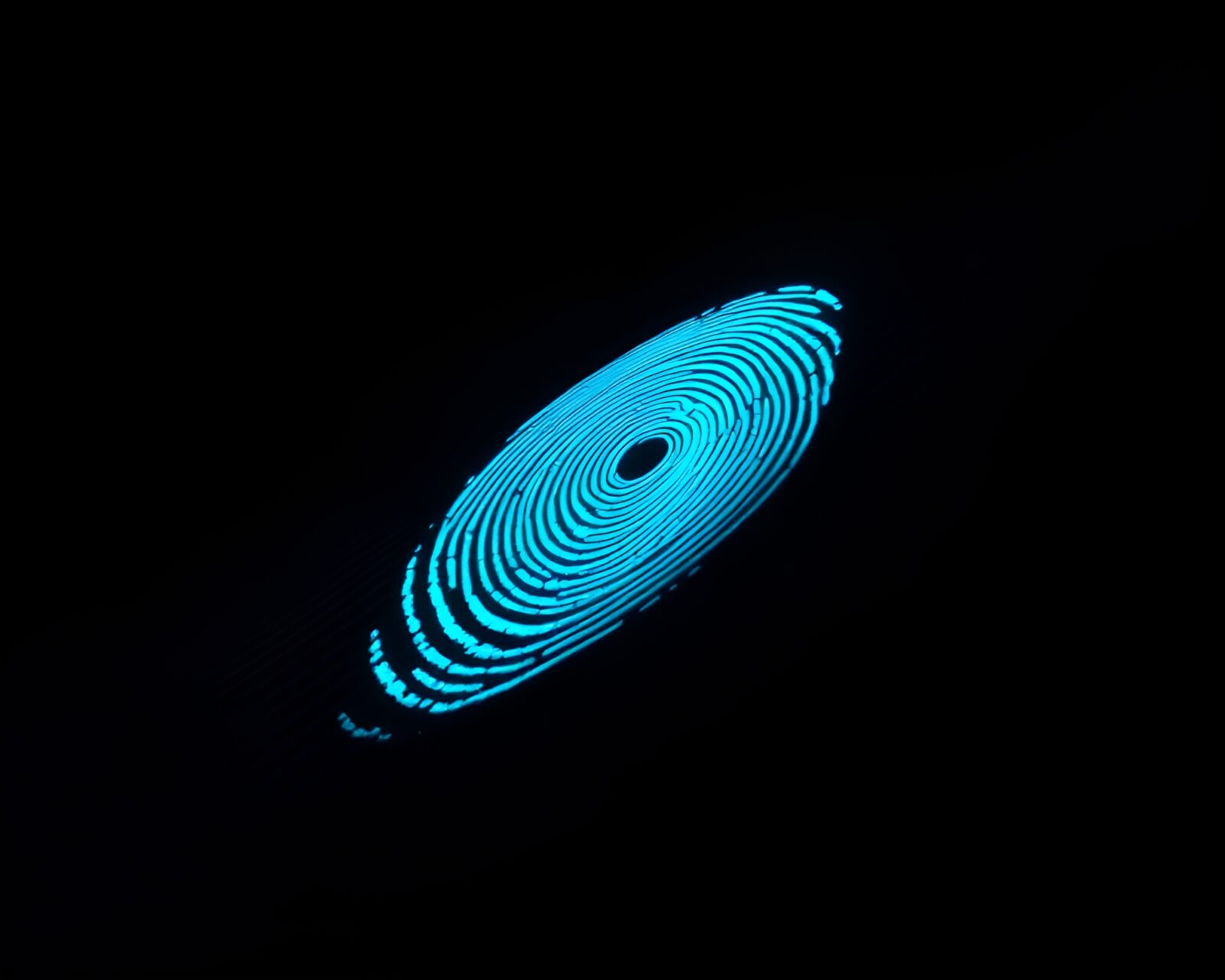 Glowing sand dune with intricate fingerprint swirls under natural light