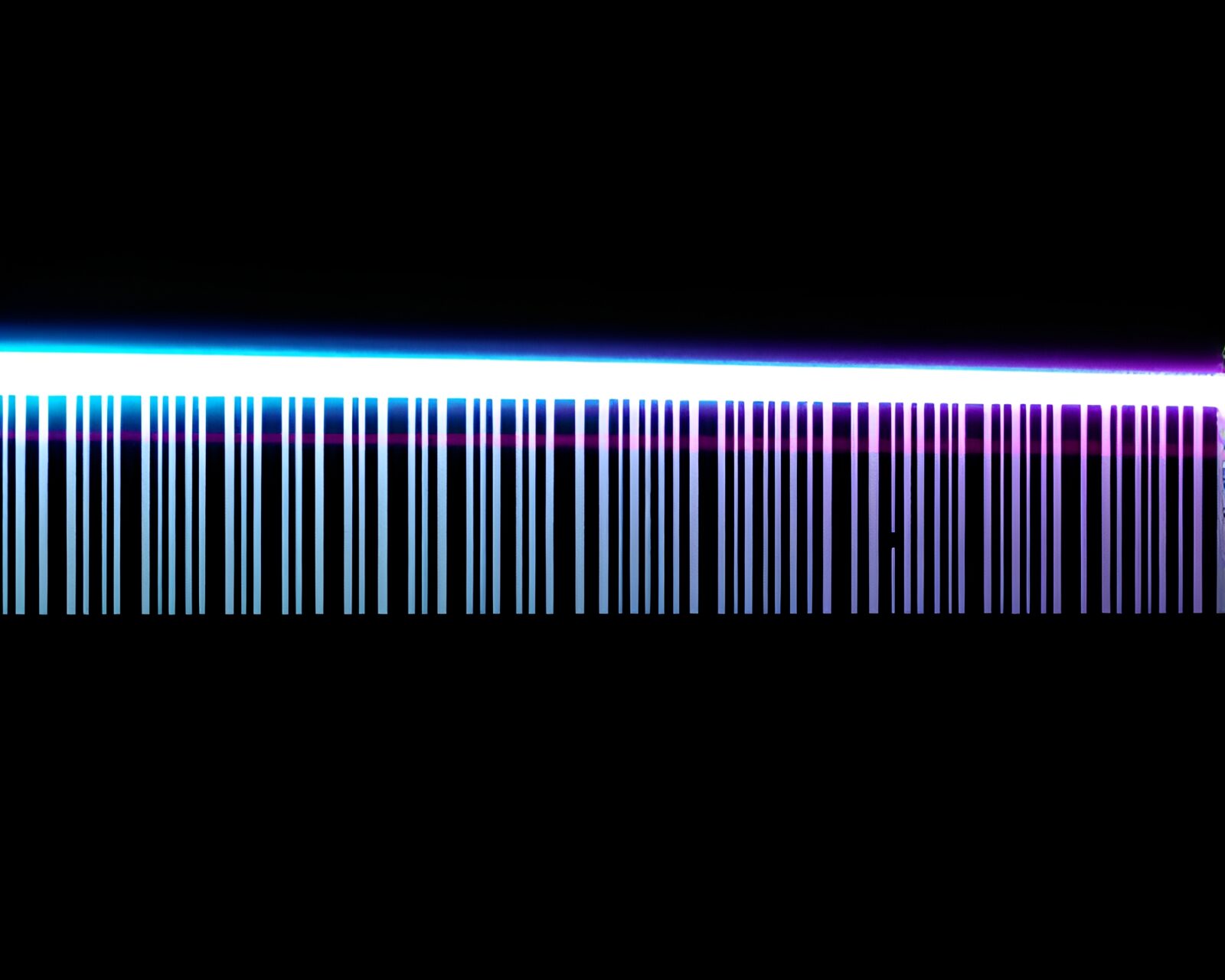 Glowing laser sword on barcode background with dramatic lighting