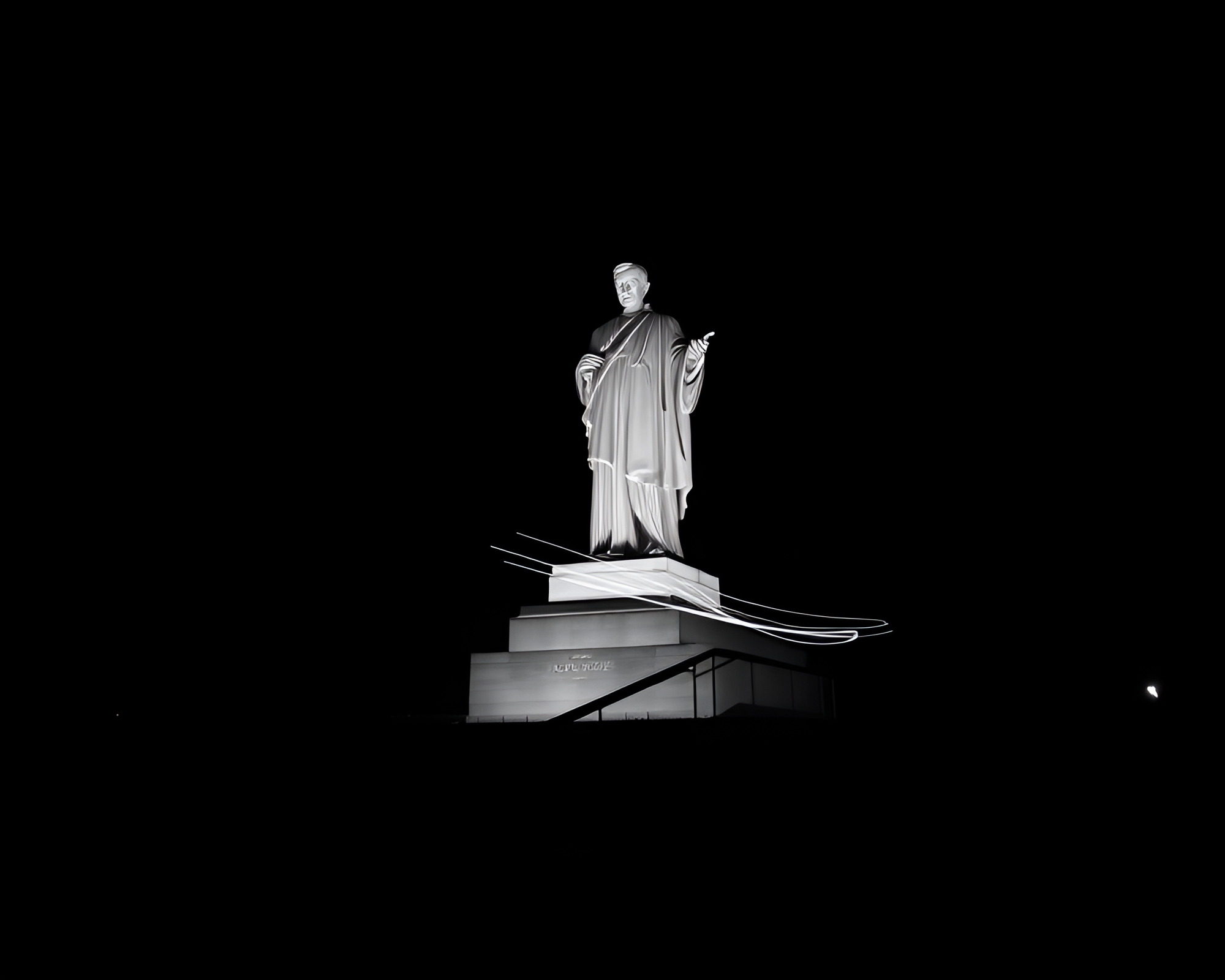 Glowing Statue with Light Trails in Black and White – free AI stock image