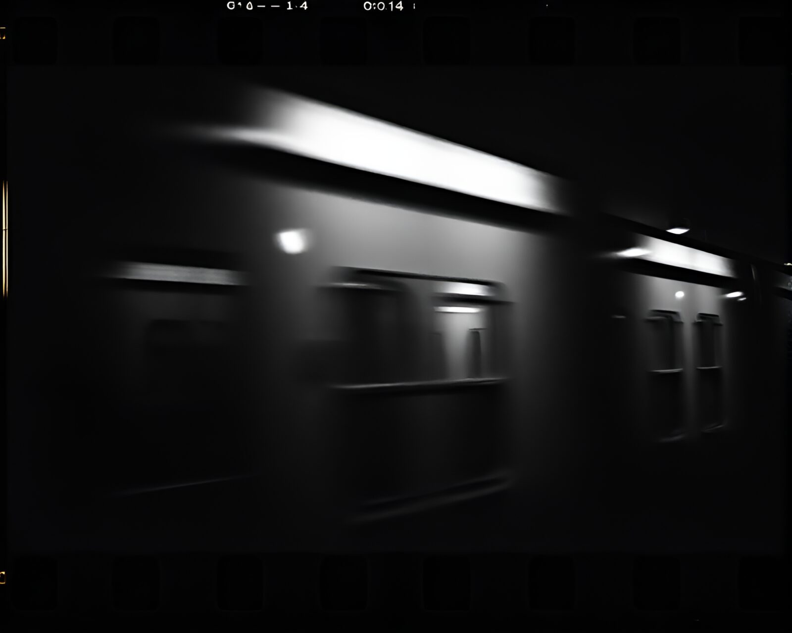 High-contrast image of train station with vintage film sprocket holes