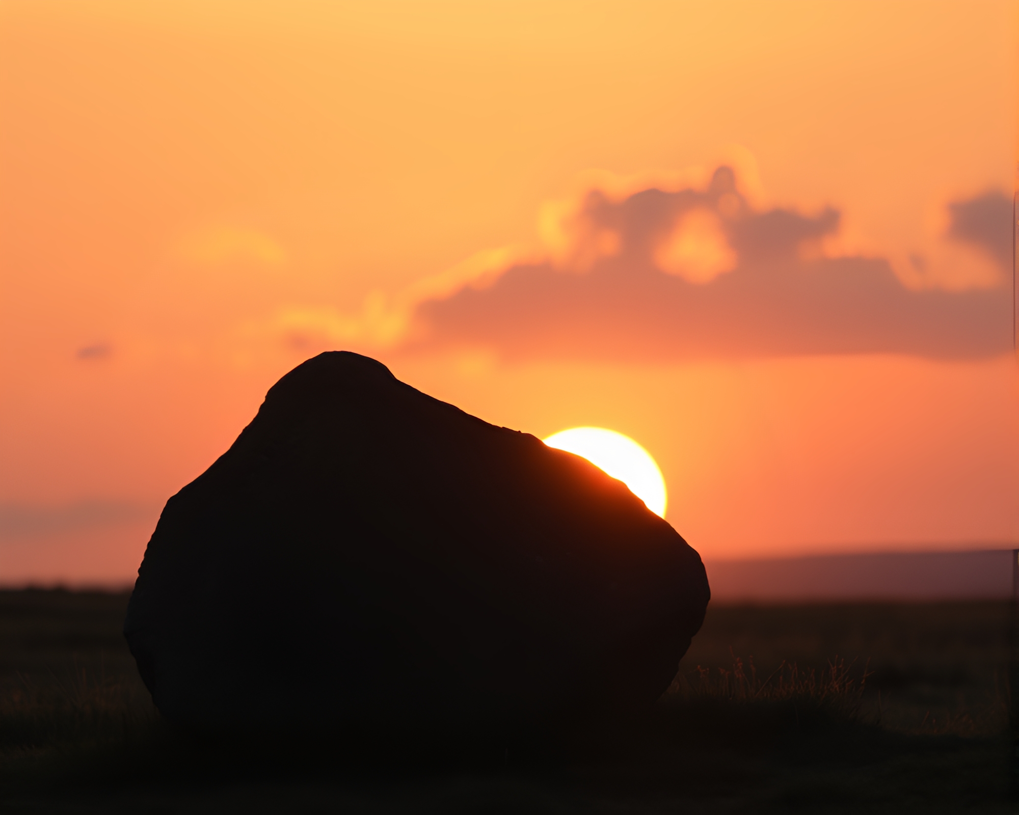 Mystical Glowing Rune Stone at Sunrise Silhouette Portrait – free AI stock image