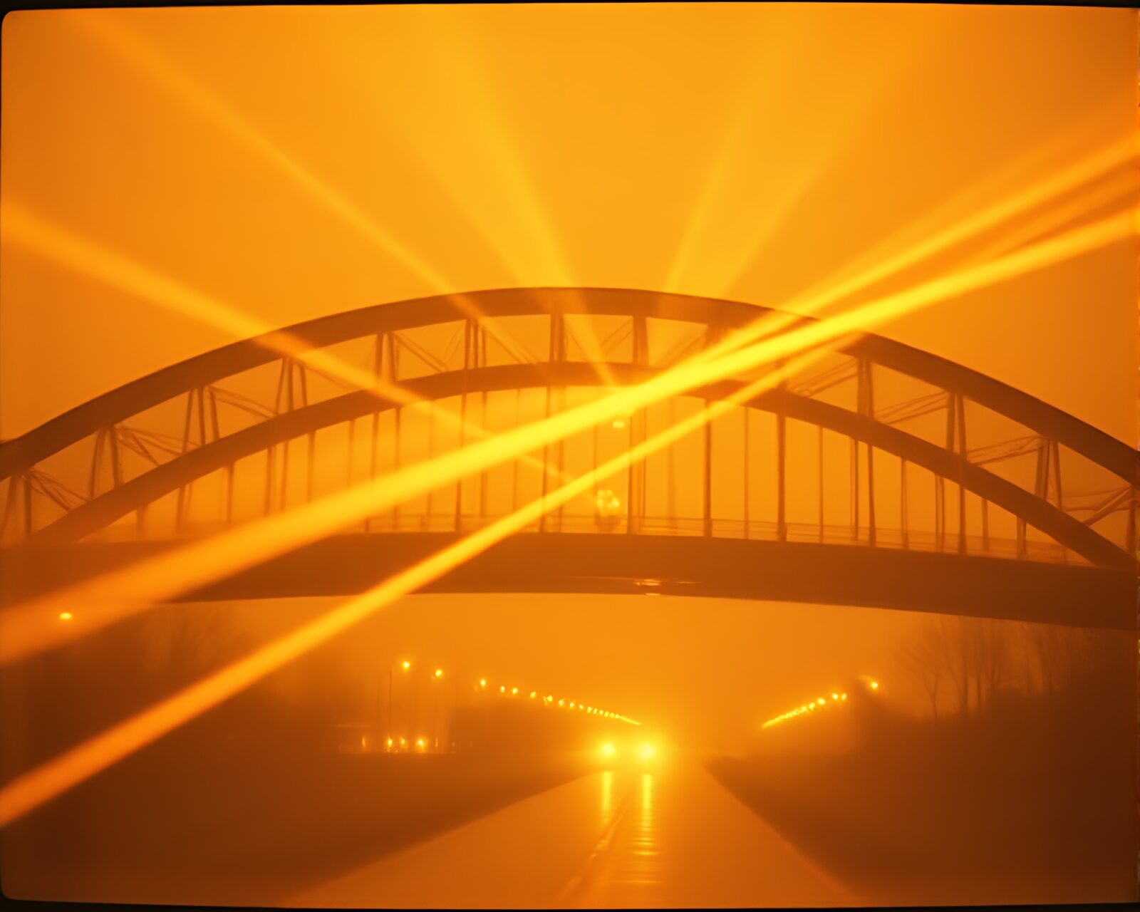Sepia-tone image of glass bridge bathed in mysterious laser beams