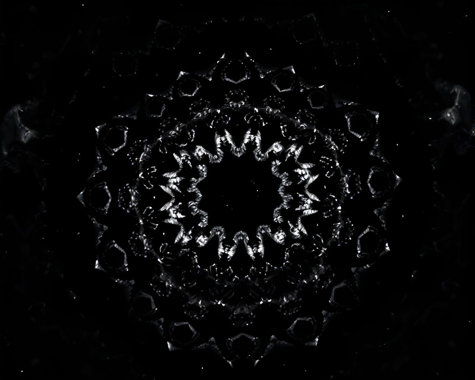 Desaturated Kaleidoscope design with stippled high-contrast noir style