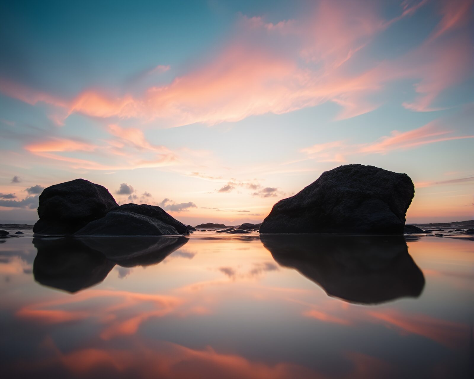 Shallow DOF image capturing beach at dawn with reflections
