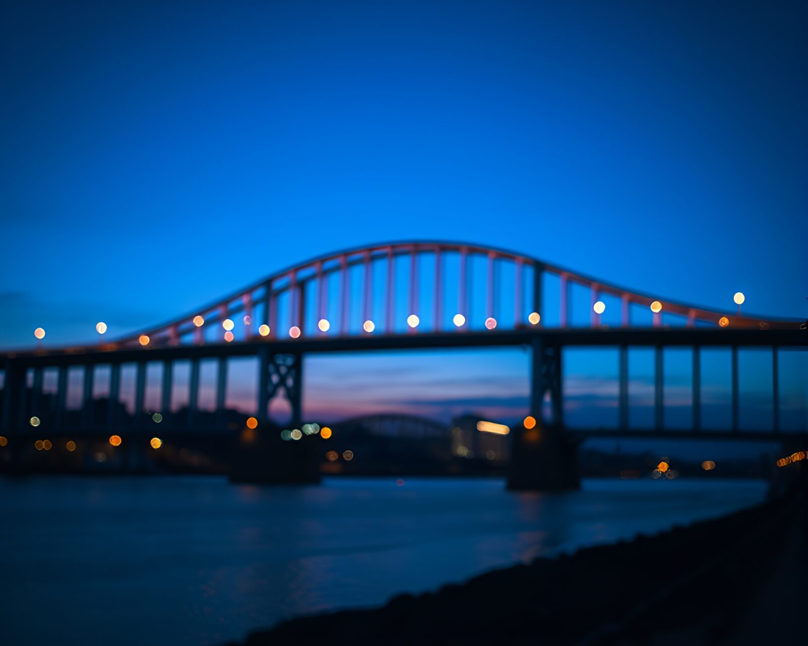 Abstract twilight blue hour bridge scenery with unique split focus effect