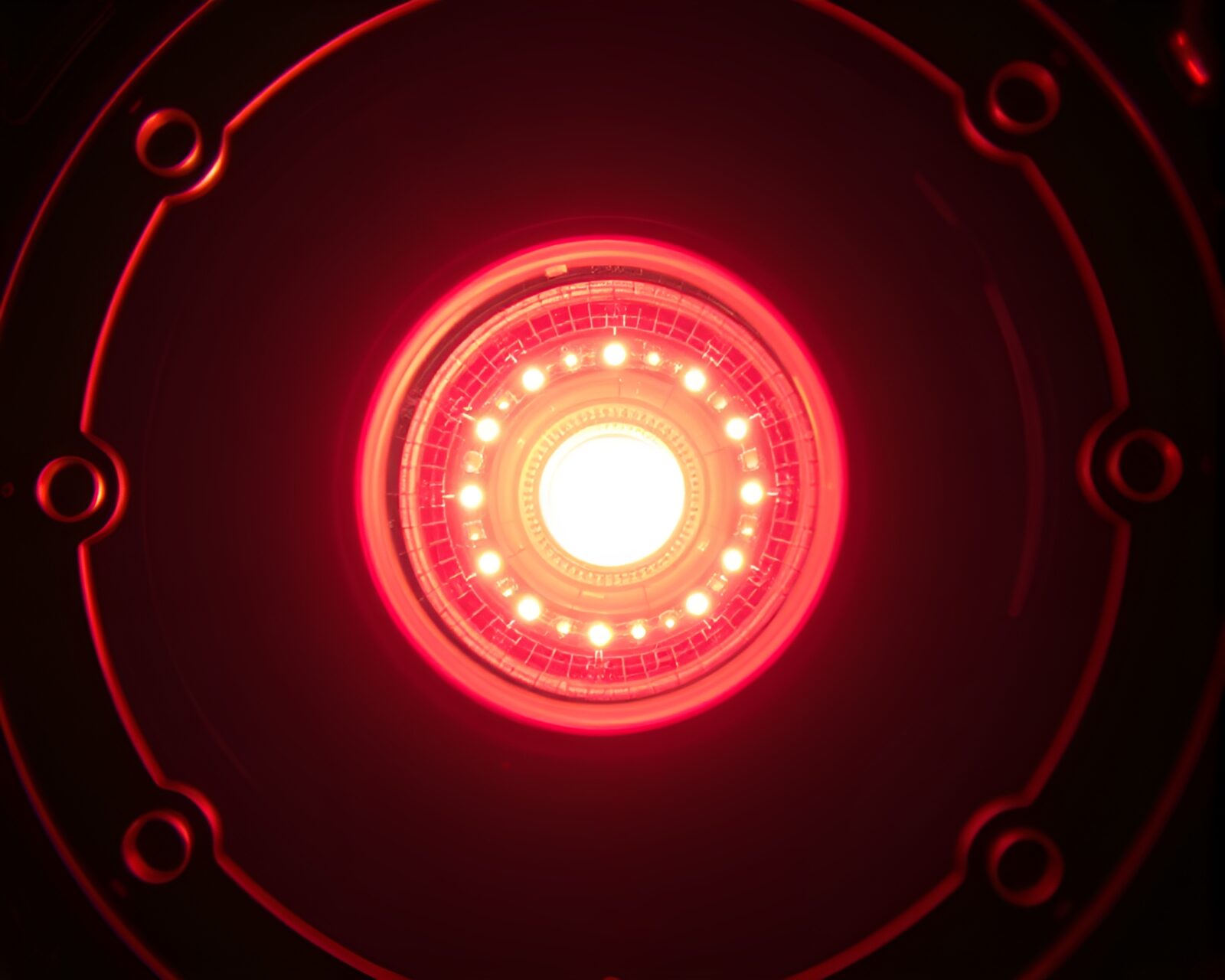 Utopian film sprocket holes framing a neon-lit reactor