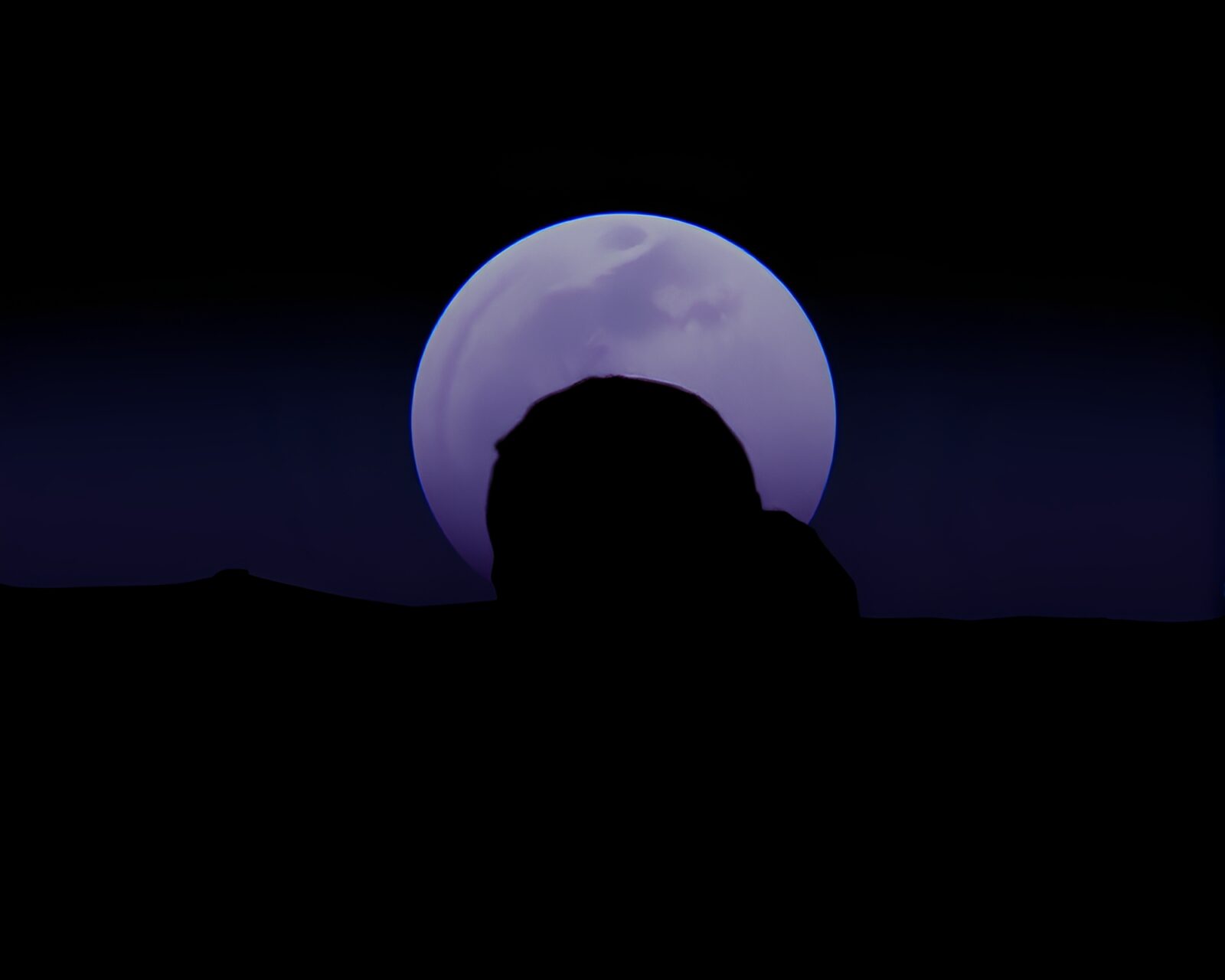 A dynamic retro-styled silhouette of a telescope reflecting on water